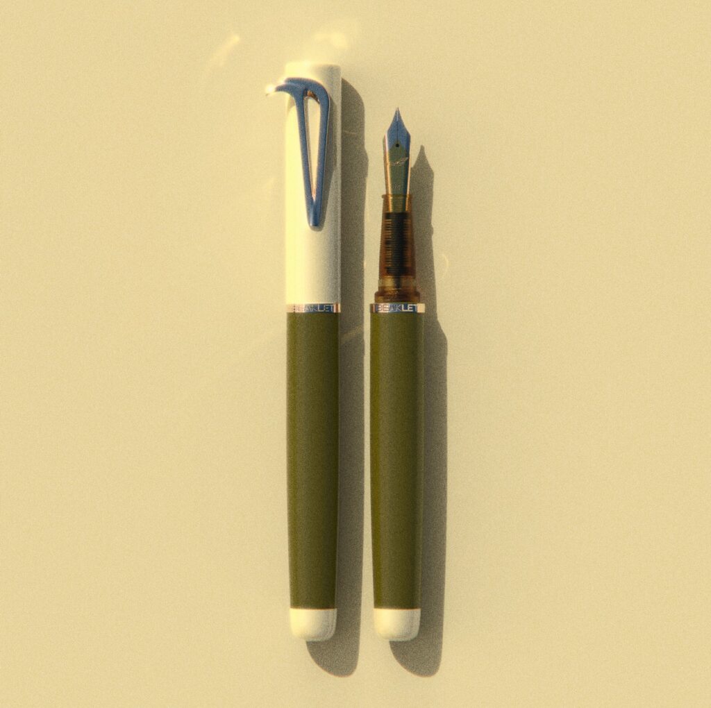 Beaklet Athens writing instrument, capped and uncapped, with a pale cap and olive barrel.