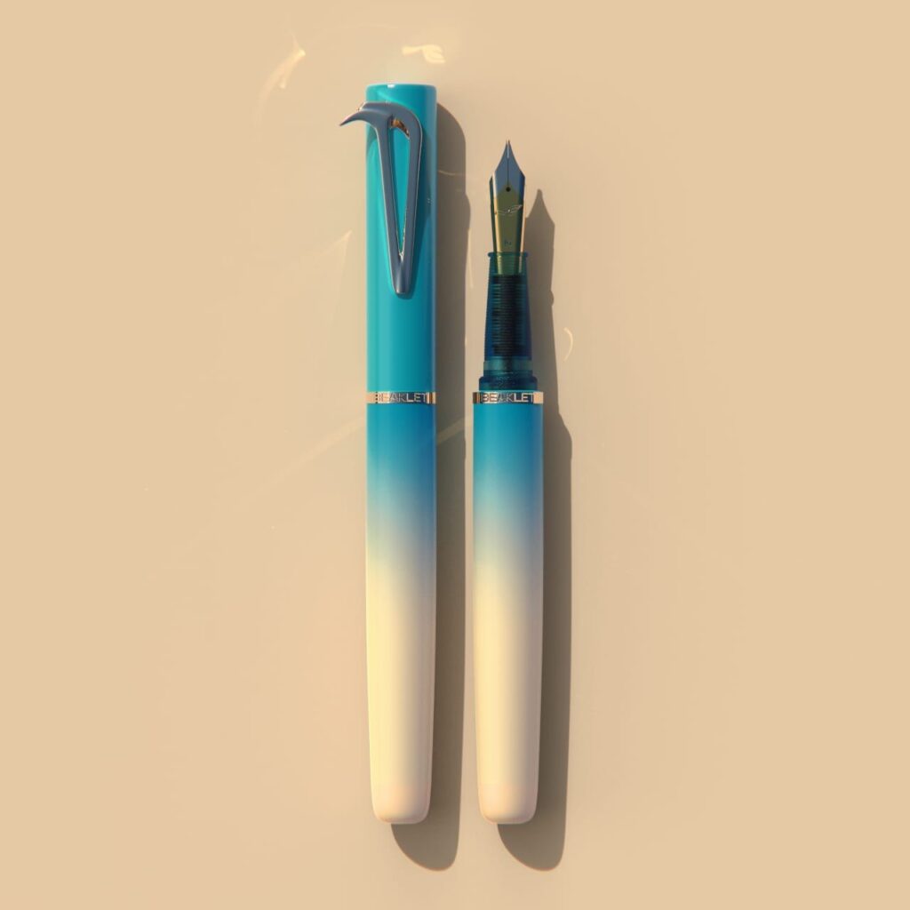 Beaklet Santorini writing instrument, capped and uncapped, turquoise fading to ivory.